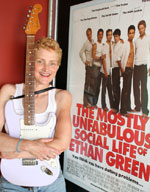 Olivia Duke with poster of movie, The Mostly Unfabulous Social Life of Ethan Green